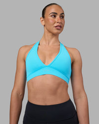 Woman wearing Stamina Sports Bra - Blue Atoll | Set:true | Angle:front | Model:Sophie | Size:S