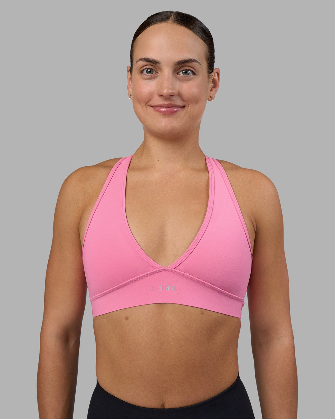 Woman wearing Stamina Sports Bra - Candy Pink | Model:Keisha | Size:S