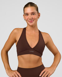 Woman wearing Stamina Sports Bra - Hot Chocolate | Set:true | Angle:front | Model:Amity | Size:S | Thumbnail Index: 1