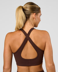 Woman wearing Stamina Sports Bra - Hot Chocolate | Set:true | Angle:back | Model:Amity | Size:S