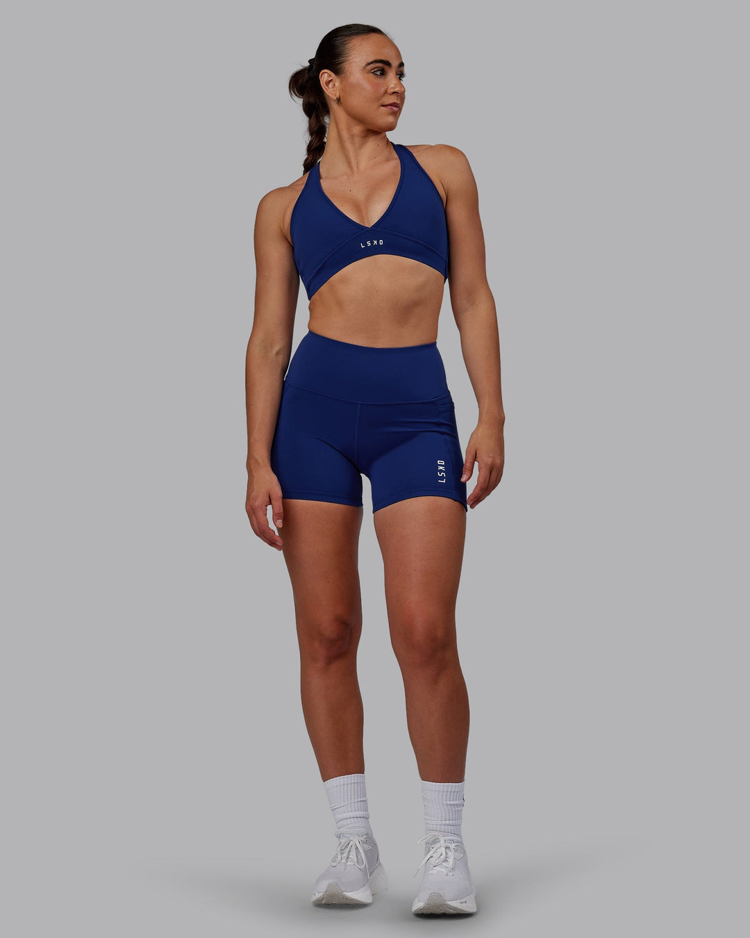 Woman wearing Stamina Sports Bra - Midnight Blue