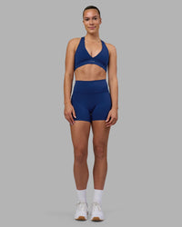 Woman wearing Stamina Sports Bra - Midnight Blue | Model:Charlize | Size:S