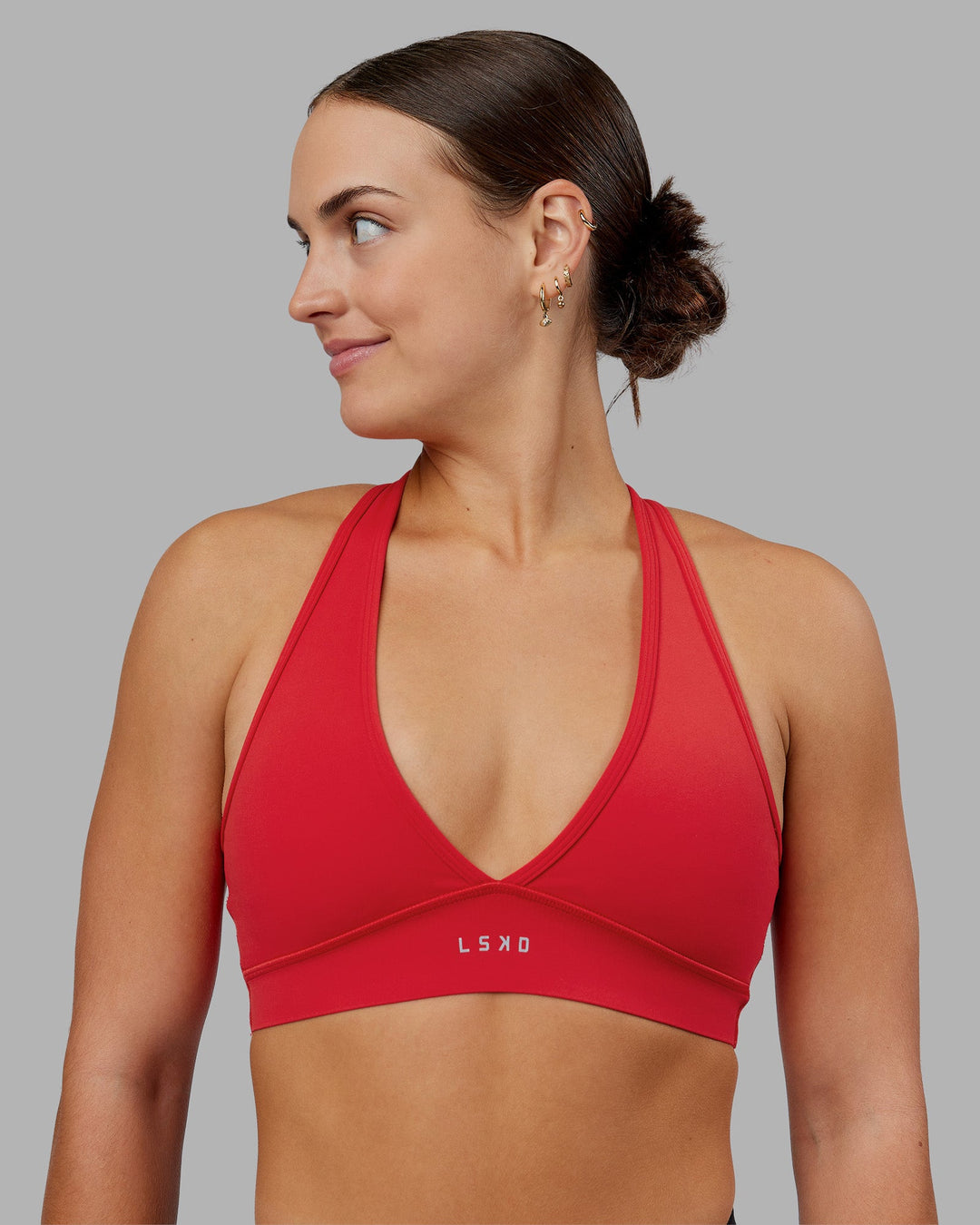 Woman wearing Stamina Sports Bra - Scarlet | Set:true | Angle:front | Model:Keisha | Size:S - view 6