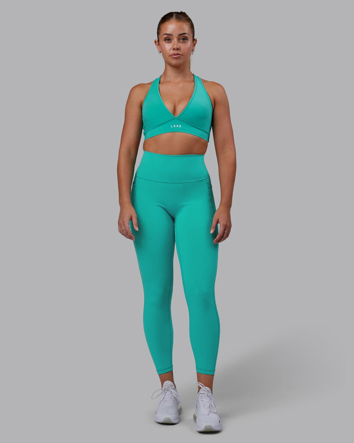 Woman wearing Stamina Sports Bra - Turquoise Tide
