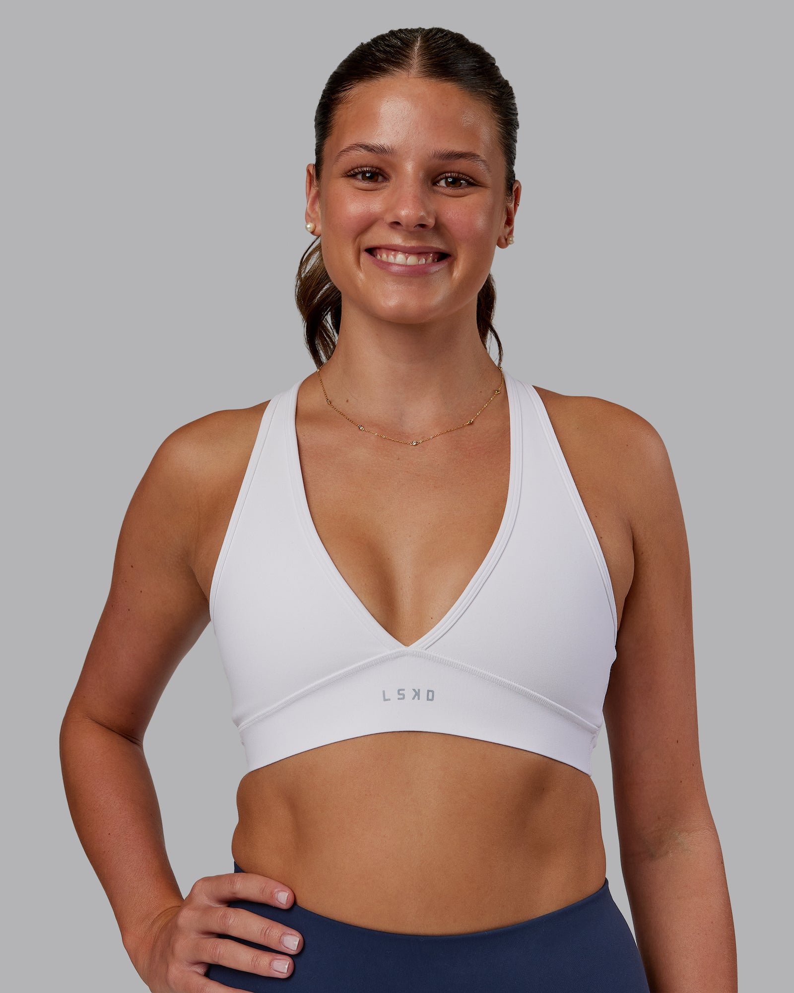Woman wearing Stamina Sports Bra - White | Model:Phoebe | Size:S