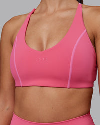 Woman wearing Stellar Sports Bra - Hot Pink | Model:Rhiley | Size:S