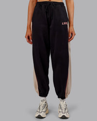 Woman wearing Stitch Up Fleece Sweat Pant - Black/Shale Beige | Model:Ella | Size:S
