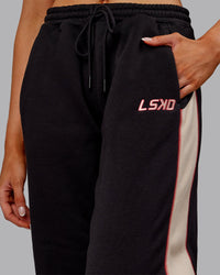 Woman wearing Stitch Up Fleece Sweat Pant - Black/Shale Beige | Model:Ella | Size:S
