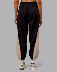 Woman wearing Stitch Up Fleece Sweat Pant - Black/Shale Beige | Model:Ella | Size:S