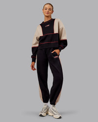 Woman wearing Stitch Up Fleece Sweat Pant - Black/Shale Beige | Model:Ella | Size:S