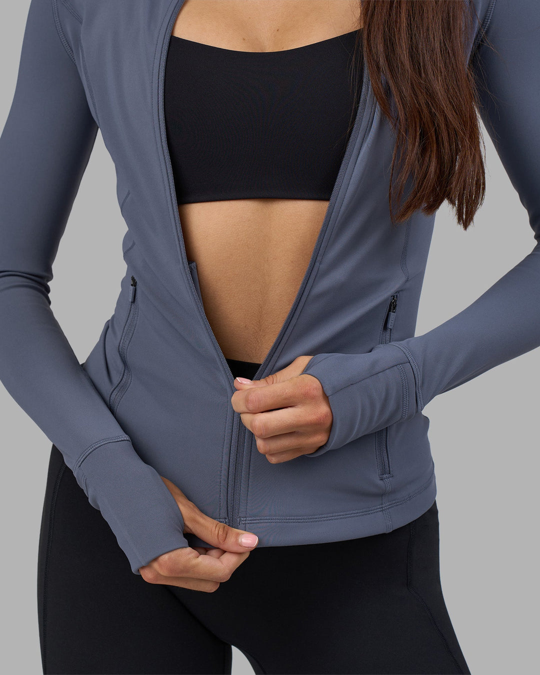 Woman wearing Stride Zip Through Jacket - Night Shadow | Model:Phoebe | Size:S