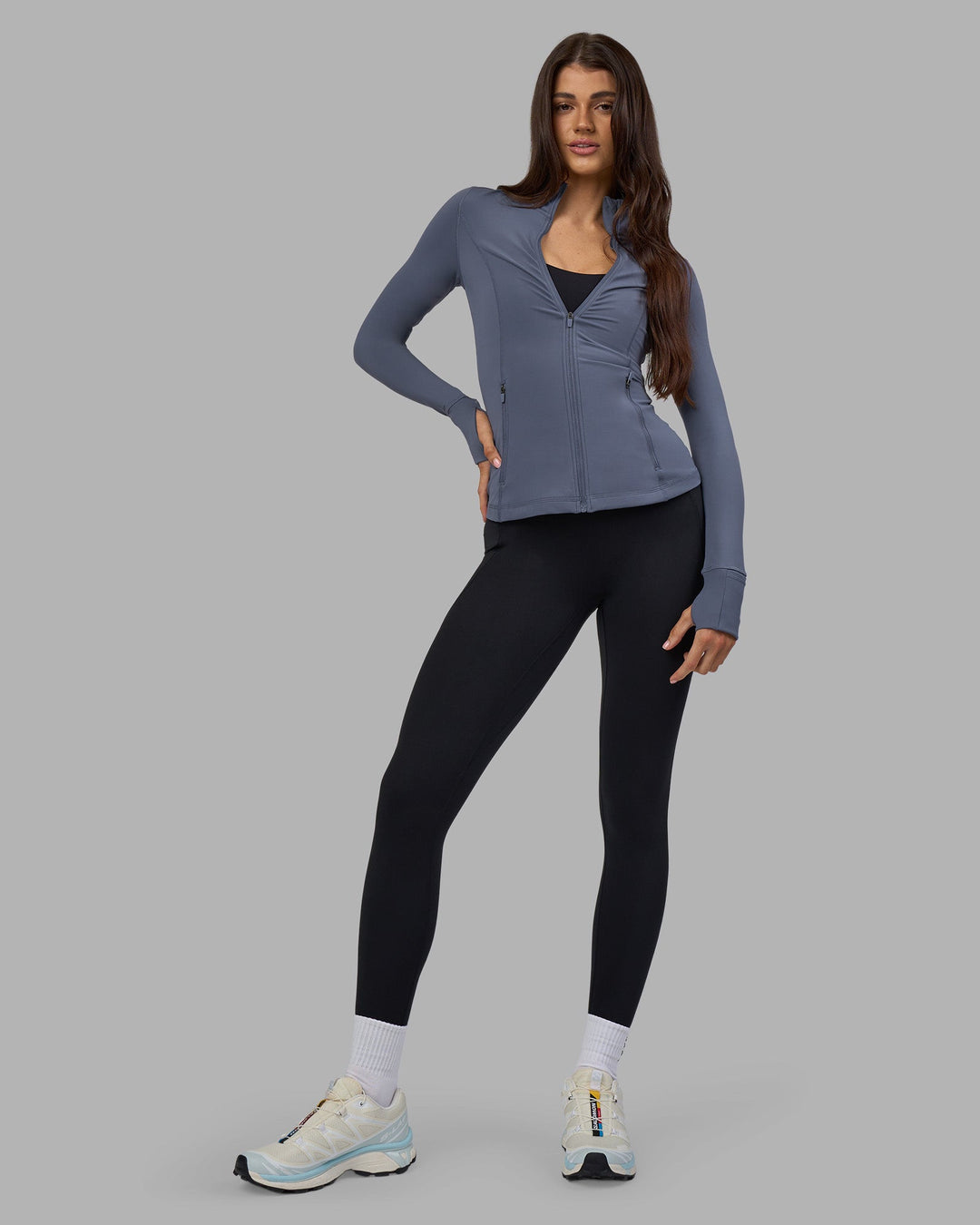 Woman wearing Stride Zip Through Jacket - Night Shadow | Model:Phoebe | Size:S