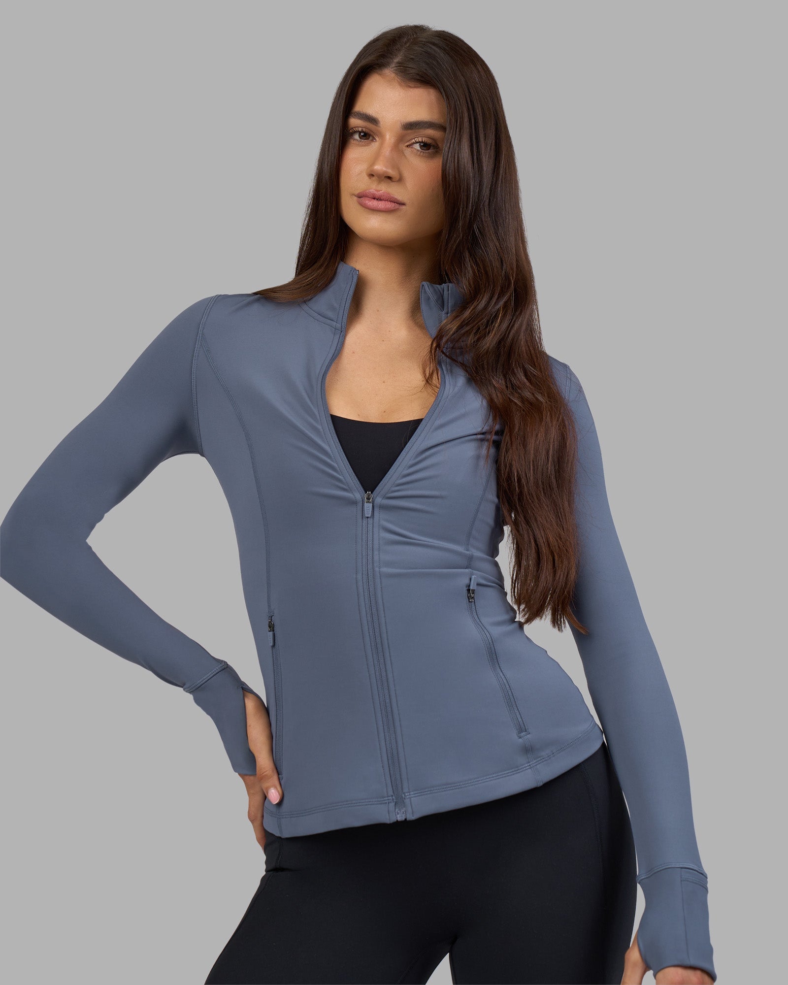 Woman wearing Stride Zip Through Jacket - Night Shadow | Model:Phoebe | Size:S