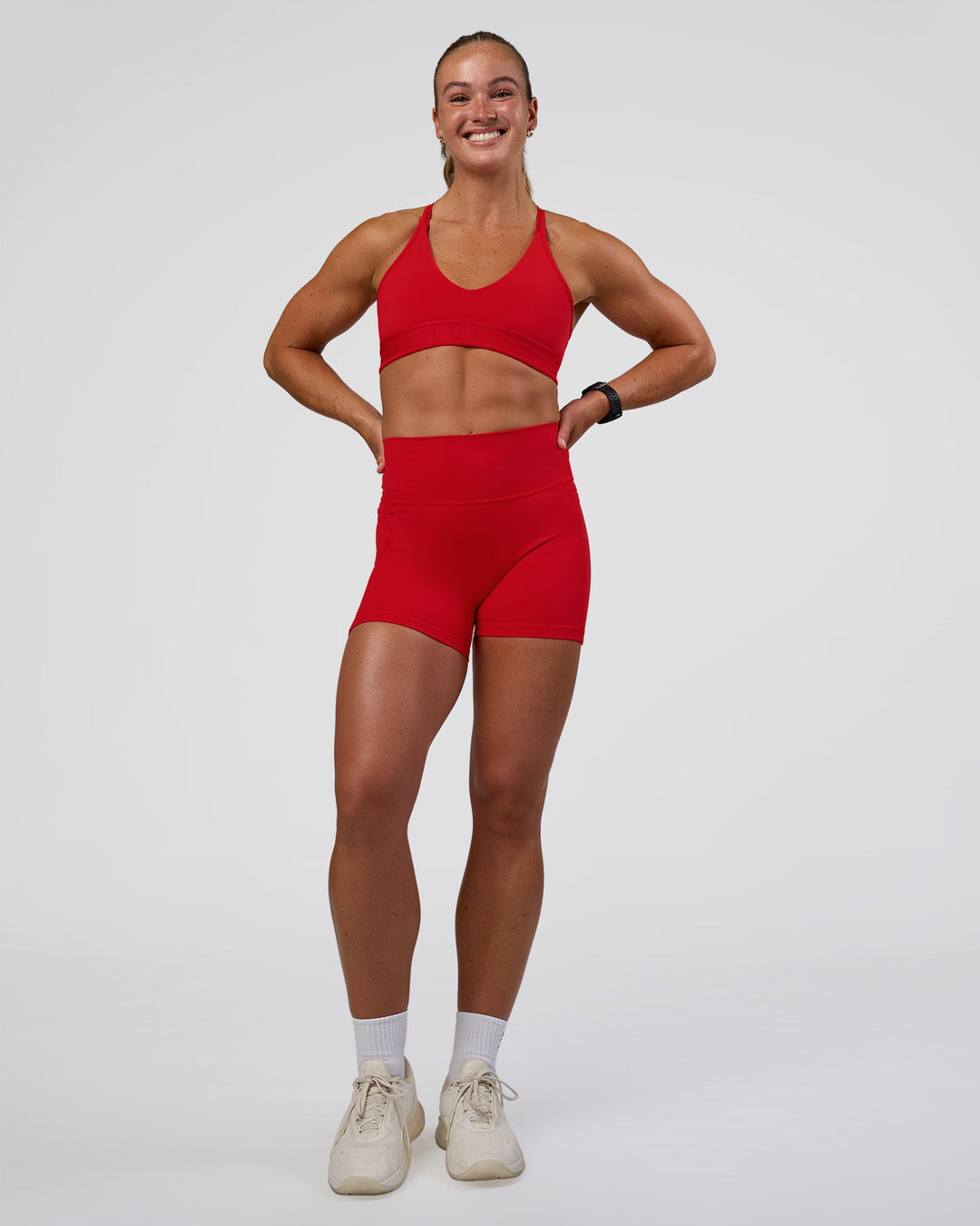 Woman wearing Strive Jacquard Sports Bra - Flame | Model:Sav | Size:S