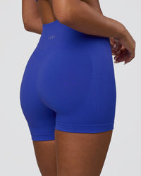 Woman wearing Surge Seamless High-Rise 4" Short - Power Cobalt | Model:Bianca | Size:S