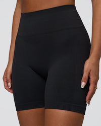 Woman wearing Surge Seamless High-Rise 6" Short - Black | Model:Bianca | Size:S