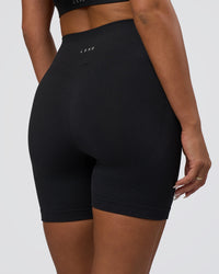 Woman wearing Surge Seamless High-Rise 6" Short - Black | Model:Bianca | Size:S