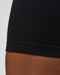 Woman wearing Surge Seamless High-Rise 6" Short - Black | Model:Bianca | Size:S