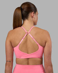 Woman wearing Twist Sports Bra - Candy Pink | Model:Phoebe | Size:S