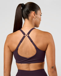 Woman wearing Twist Sports Bra D/DD/E - Midnight Plum | Model:Rhiley | Size:S | Thumbnail Index: 1