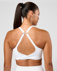 Woman wearing Twist Sports Bra D/DD/E - White | Model:Rhiley | Size:S