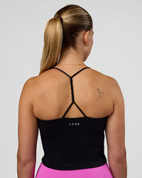 Woman wearing Twister Shelf Bra Tank - Black | Model:Myrte | Size:S