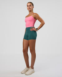 Woman wearing Twister Shelf Bra Tank - Candy Pink | Model:Myrte | Size:S
