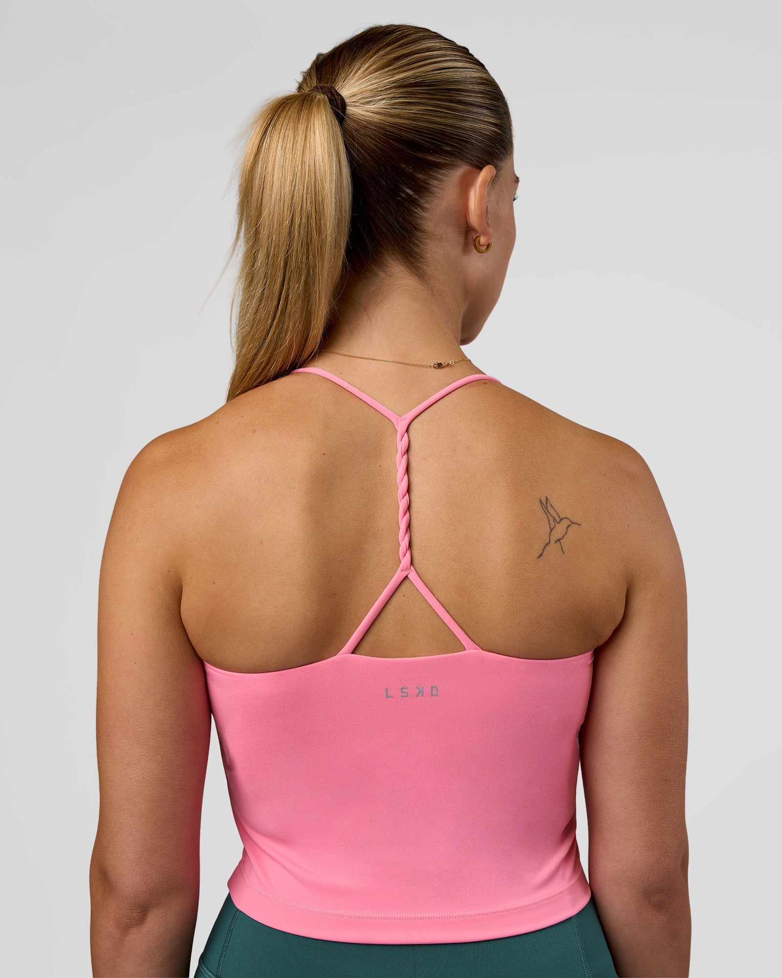 Woman wearing Twister Shelf Bra Tank - Candy Pink | Model:Myrte | Size:S