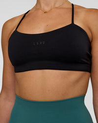 Woman wearing Twister Sports Bra - Black  | Model:Myrte | Size:S