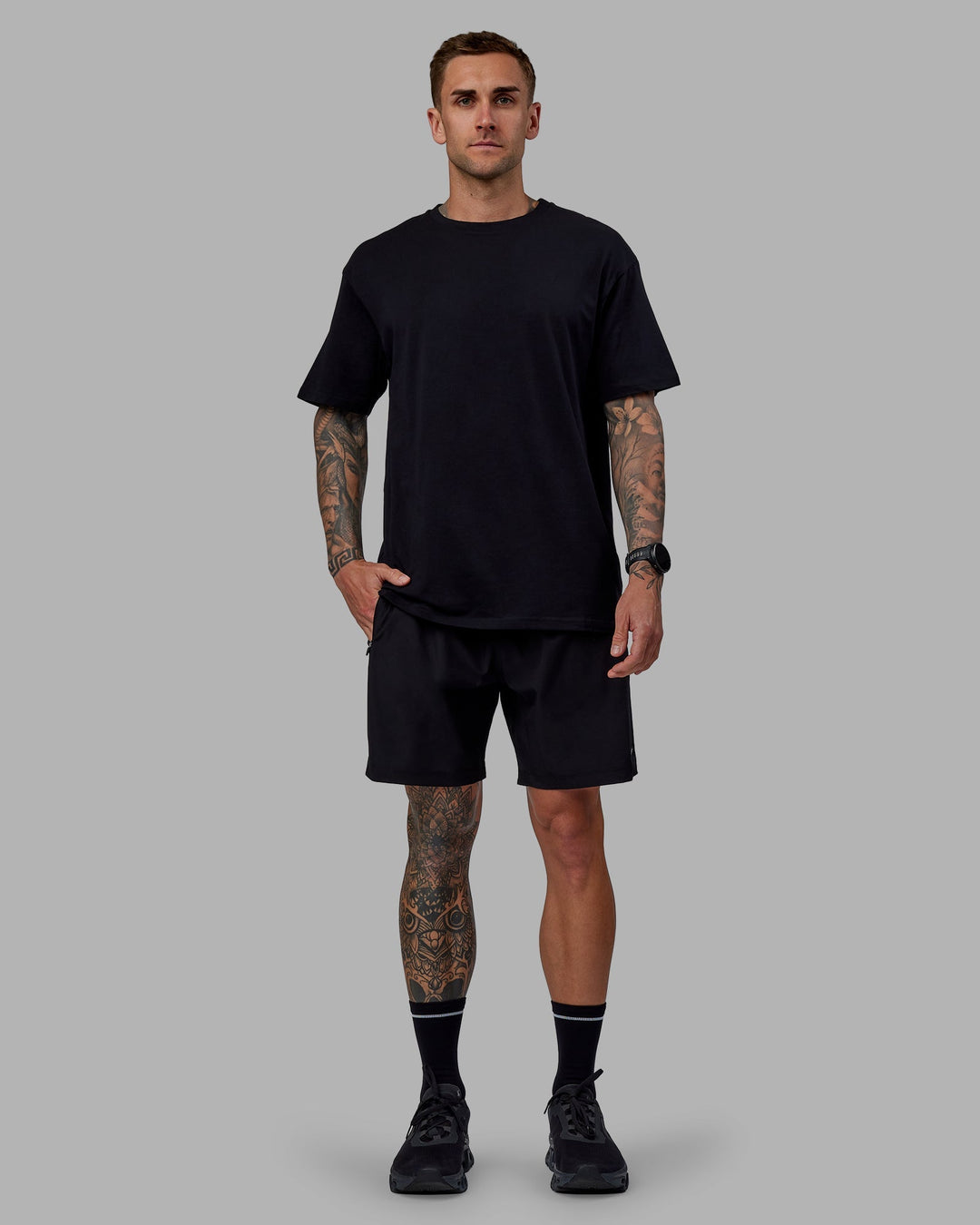 Man wearing Unisex Keep On Running FLXCotton Tee Oversize - Black-White