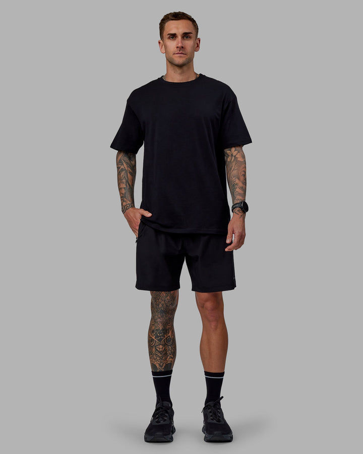 Man wearing Unisex Keep On Running FLXCotton Tee Oversize - Black-White
