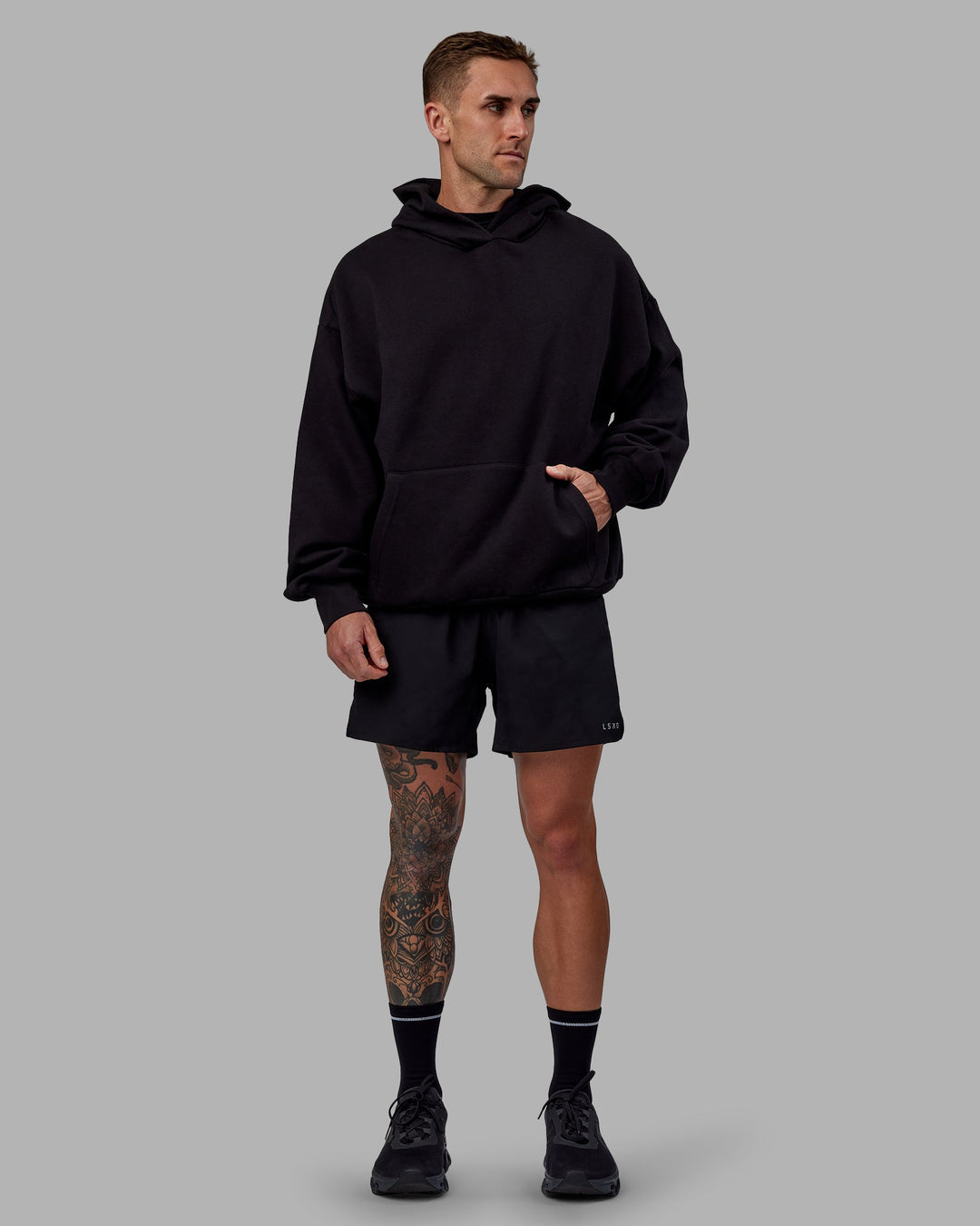 Man wearing Unisex Keep on Running Hoodie Oversize - Black-White