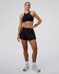Woman wearing Unstoppable Lined Short - Black | Model:Emelia | Size:S