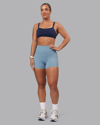 Woman wearing Vantage Sports Bra - Future Navy