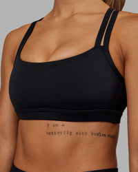 Woman wearing Velocity Sports Bra - Black | Model:Vanessa | Size:S