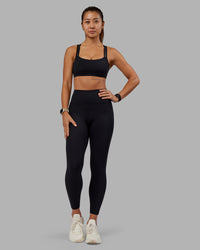 Woman wearing Velocity Sports Bra - Black | Model:Vanessa | Size:S