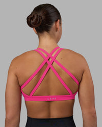 Woman wearing Velocity Sports Bra - Ultra Pink | Model:Keisha | Size:S