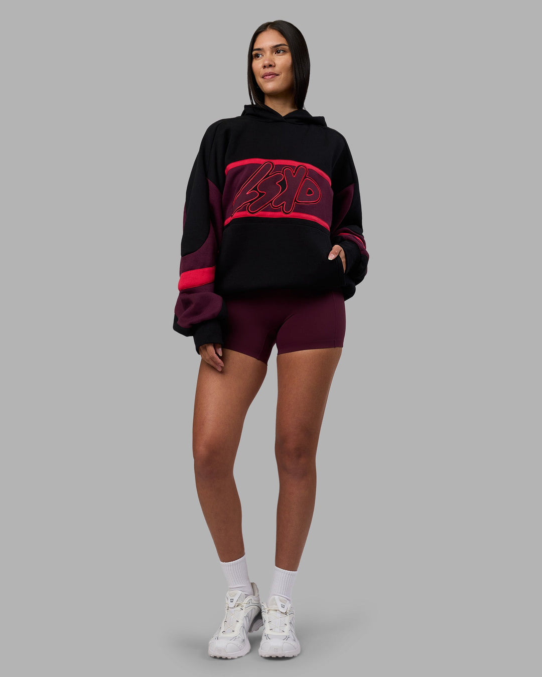 Woman wearing Vibe Oversized Unisex Hoodie - Black-Cherry Lacquer | Model:Rhiley | Size:S - view 8