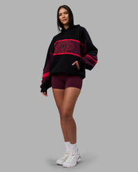 Woman wearing Vibe Oversized Unisex Hoodie - Black-Cherry Lacquer | Model:Rhiley | Size:S | Thumbnail Index: 4