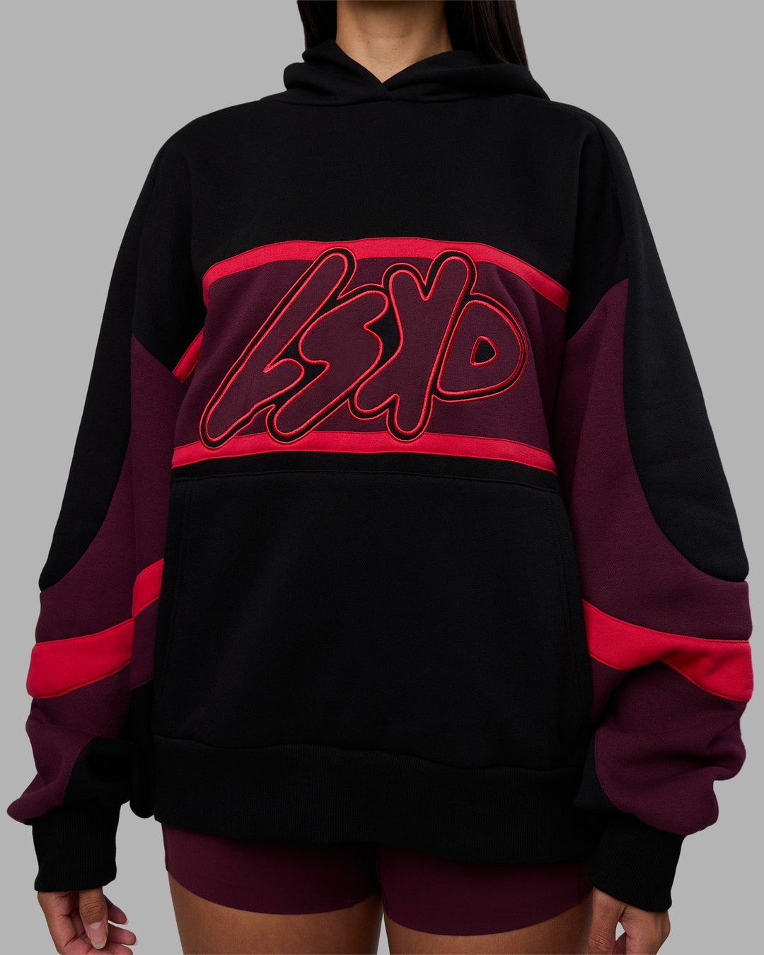 Woman wearing Vibe Oversized Unisex Hoodie - Black-Cherry Lacquer | Model:Rhiley | Size:S - view 9