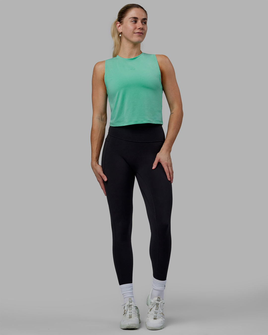 Woman wearing Vital Cropped Training Tank - Cockatoo