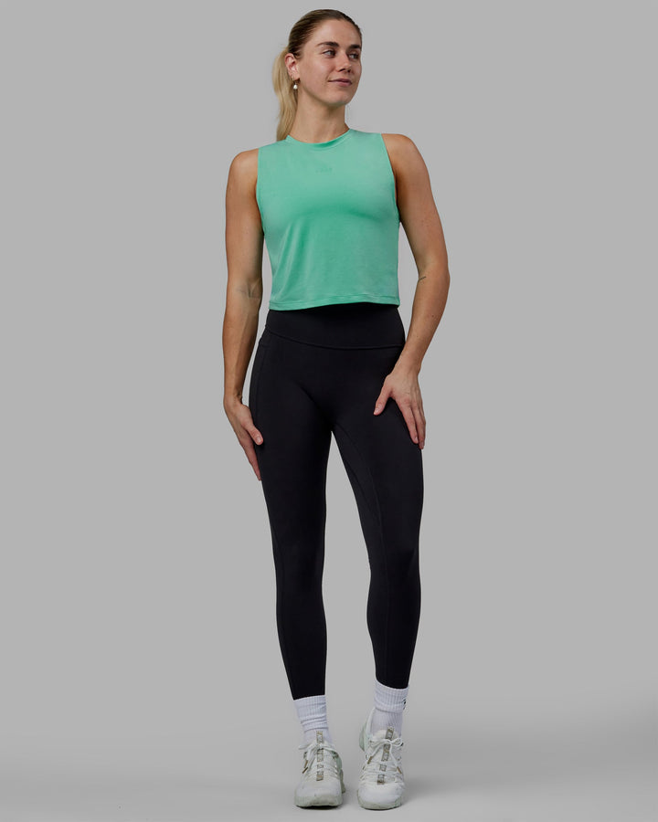 Woman wearing Vital Cropped Training Tank - Cockatoo
