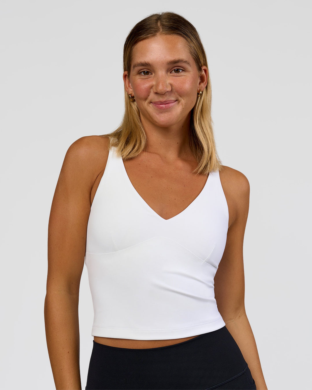 Woman wearing Vitality Active Tank - White | Model:Amity | Size:S