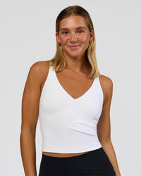 Woman wearing Vitality Active Tank - White | Model:Amity | Size:S