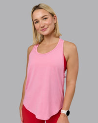 Woman wearing AeroFLX+ Drop Armhole Seamless Tank - Candy Pink | Model:Halle | Size:S