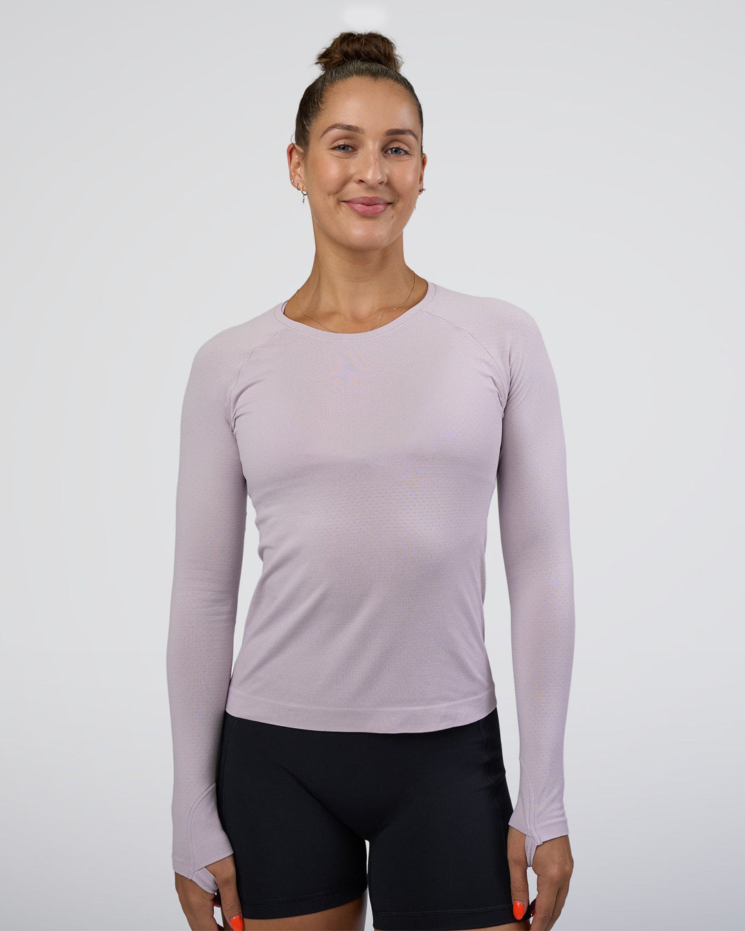 Woman wearing AeroFLX+ Seamless Long Sleeve Tee - Fair Orchid/Fair Orchid | Model:Abbey | Size:S