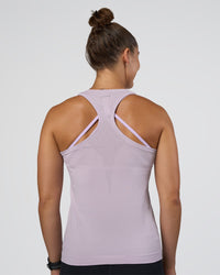 Woman wearing AeroFLX+ Seamless Tank - Fair Orchid/Fair Orchid | Model:Abbey | Size:S