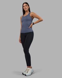 Woman wearing AeroFLX+ Seamless Tank - Night Shadow/Night Shadow | Model:Rhiley | Size:S