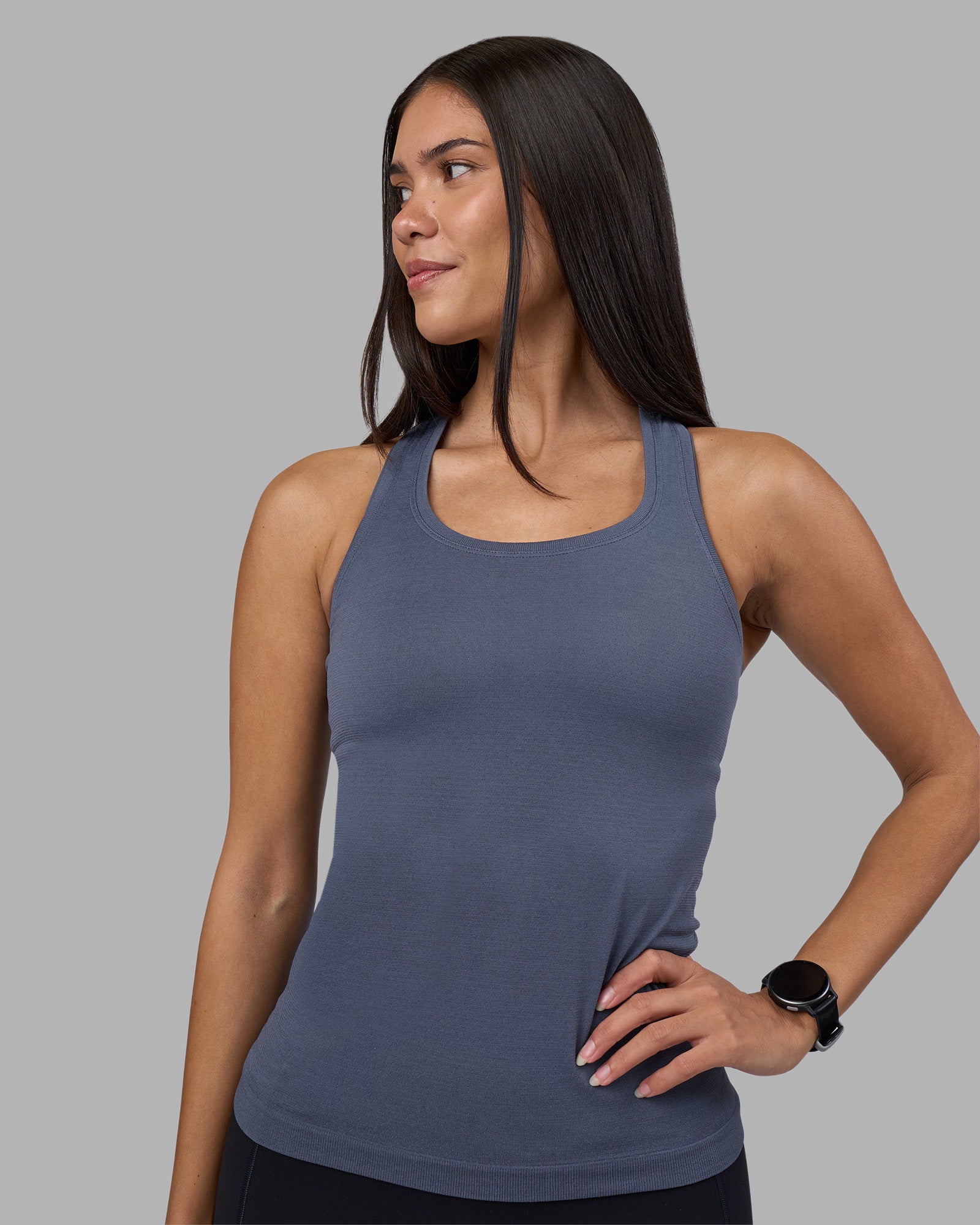 Woman wearing AeroFLX+ Seamless Tank - Night Shadow/Night Shadow | Model:Rhiley | Size:S