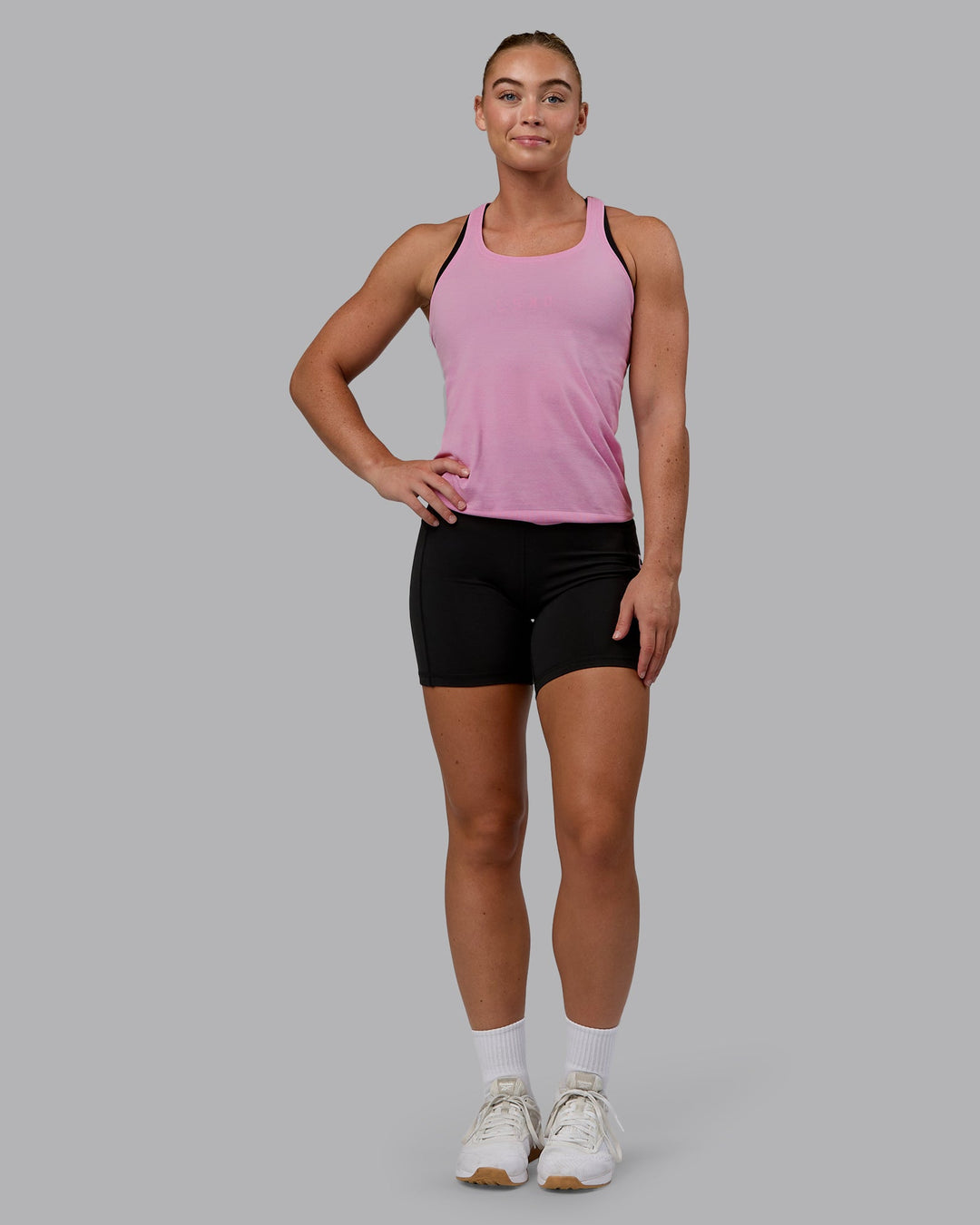 Woman wearing AeroFLX+ Seamless Tank - Pirouette/Bubblegum